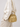 AKINNA Melissa Drawstring in Metallic Gold worn with cream tailoring