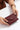 Elena Wallet in Spicy Red held in hand